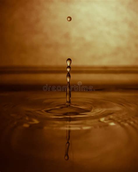 Water Dripping and Splashing with a Yellow Effect Stock Photo - Image of spray, blue: 188462386