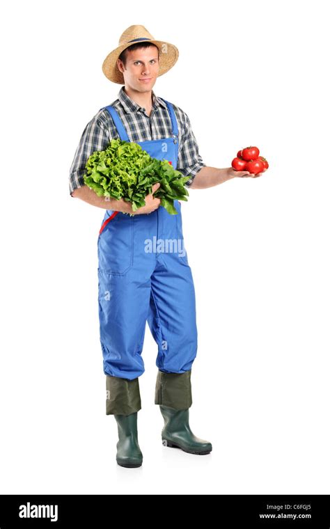 Full length portrait of a male farmer holding vegetables Stock Photo - Alamy