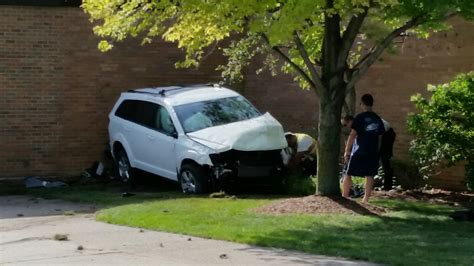 Car crashes into Jenison elementary school after hitting bicyclist