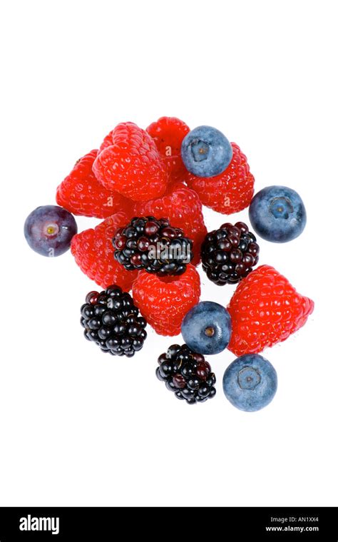 Mixed berries against a white background Stock Photo - Alamy