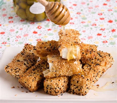 SESAME COATED MANOURI CHEESE STICKS - Odysea