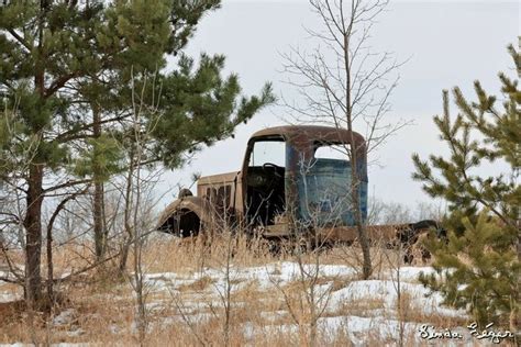 Carman, Manitoba Shot: December 24, 2011 A weather worn old truck on a snowy hill, facing ...