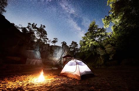 Tourist Camping on Rocky Mountain Under Night Starry Sky Stock Photo ...