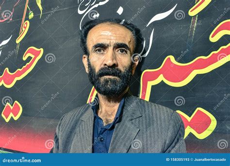 Iranian Man with Beard Poses in Front of Iranian Letters in Isfahan ...