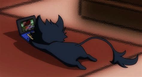 a cartoon cat laying on the floor with a laptop