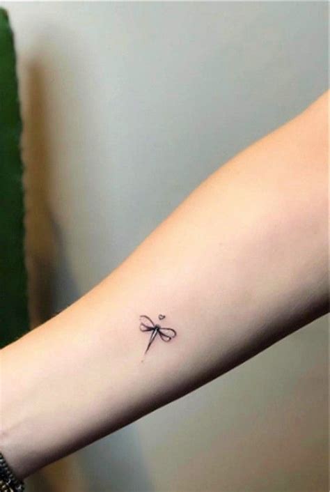 Tiny dragonfly | Feminine tattoos, Dragonfly tattoo design, Simplistic ...