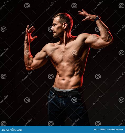 Man with Athletic Body Showing Muscle Stock Image - Image of bodybuilder, male: 211783957