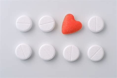 Red heart form pill surrounded by white pills. Pills of love. | Red heart, Pill, Red