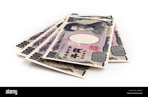 Japanese yen banknotes on white background Stock Photo - Alamy