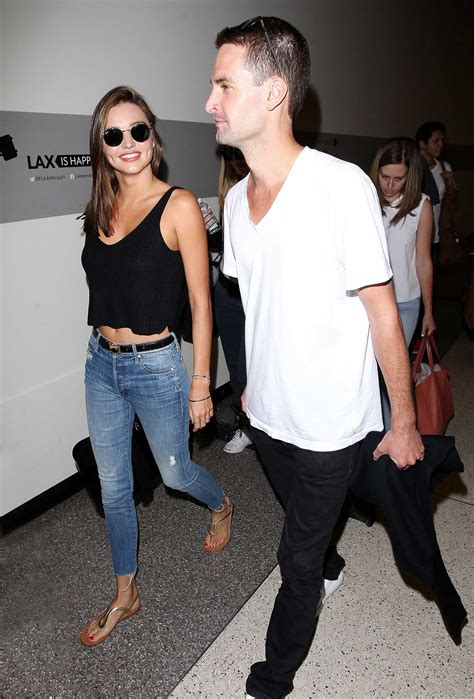 Miranda Kerr and Evan Spiegel Depart LAX Airport – Celeb Donut