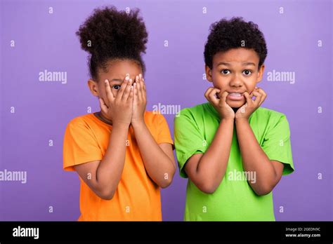 Photo of two young little afro kids worried scared horrified bite ...