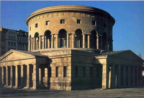 an old round building with columns and arches