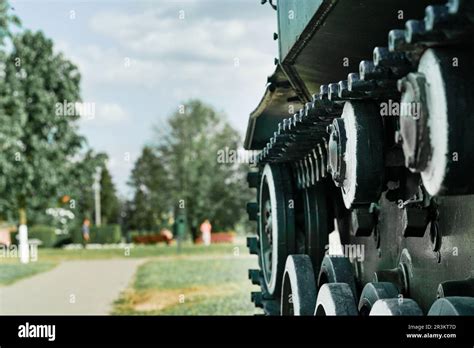 Old tank. Wheels and track closeup and peaceful background. Monument to old weapons close-up ...