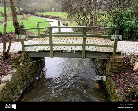 Small wooden bridge over river, Cornwall, UK Stock Photo - Alamy