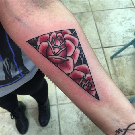 Simple triangle shaped tattoo on forearm stylized with red roses - Tattooimages.biz