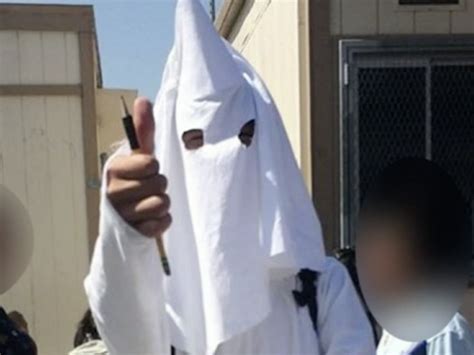 Student wears Ku Klux Klan costume for project