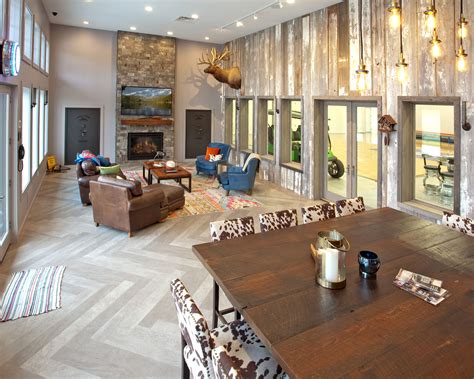 a living room filled with furniture and lots of windows