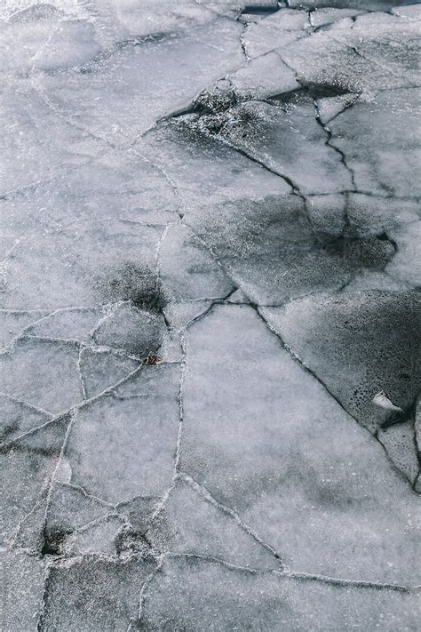 "Cracks In Thick Solid Layer Of Ice Of A Frozen Lake" by Stocksy ...