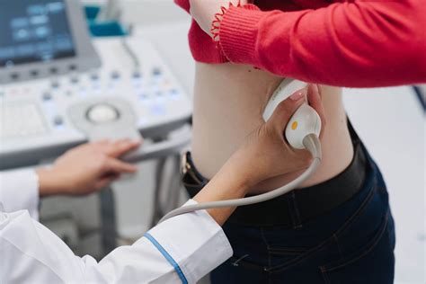 Renal ultrasound examination of kidneys. Hospital doctor examines a ...