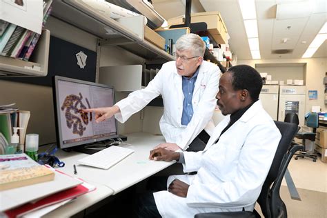 Drs. Idowu Aimola and Francis Collins | NIH director Dr. Fra… | Flickr