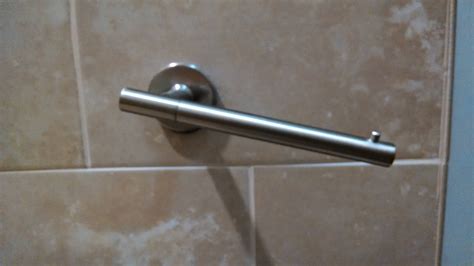 tile - How do I secure a one-armed toilet paper holder, which constantly slips off the mount ...