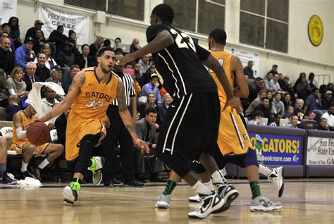 SF State Gators' Decensae White (32), left, tries to driv… | Flickr