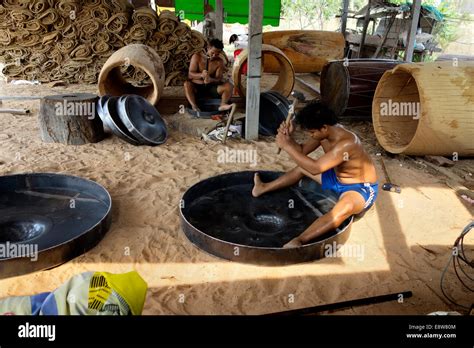 Gongs and drums in making. Shaping gong with hammer.tradesman,skills Stock Photo - Alamy