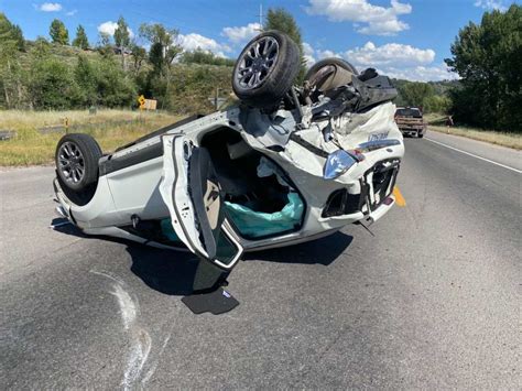 Car upside down, crash blocking all lanes on Hwy 22