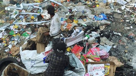 Toxic Smoke at Landfills: Sanitation Workers Sorting Garbage Amid Environmental Hazards ...