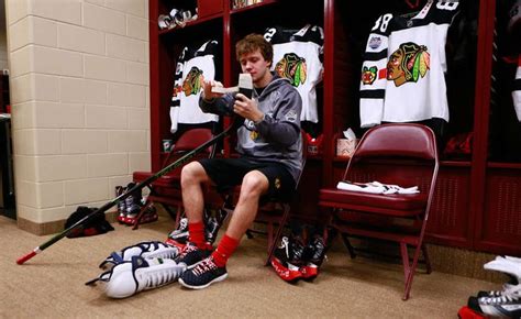 Artemi Panarin tapes his stick before practicing at TCF Bank Stadium ...