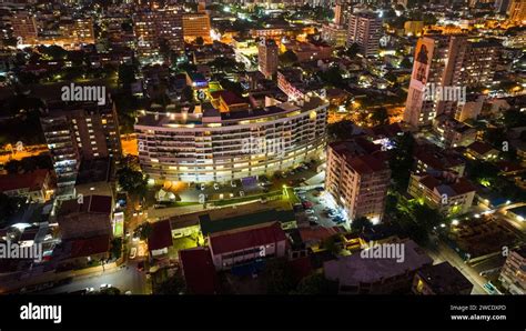 An aerial photograph capturing the illuminated skyline of the distant ...