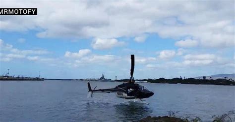 Helicopter crash-lands in water in Hawaii - CBS News