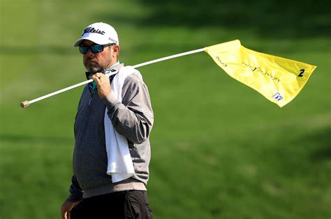 What is the significance of flags on a golf course?