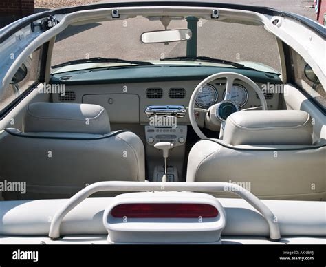 Nissan Figaro interior with convertible roof down Stock Photo - Alamy