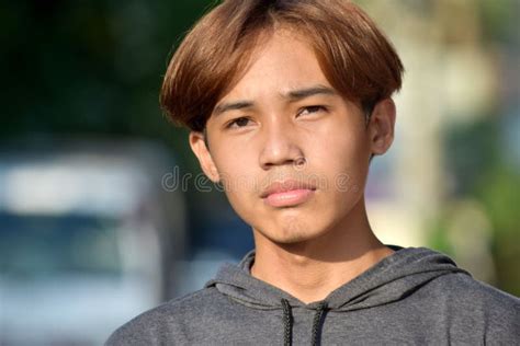 Portrait of a Teenage Southeast Asian Boy with Brown Hair in the Street Stock Photo - Image of ...