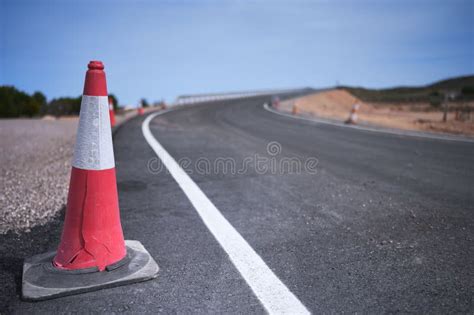 Curve of a Road Under Construction with Traffic Cones Stock Image - Image of closeup, pave ...