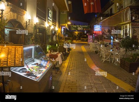 Nightlife, gastronomy at a small alley of Kaleici, the old town of Antalya, turkish riviera ...