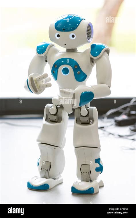 A small robot with human face and body - humanoid. Artificial ...