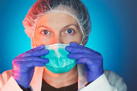 Female Surgeon Puts on Protective Surgical Mask before Operation Stock Photo - Image of mask ...