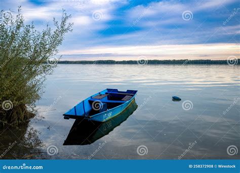 Fishing Boat in a Lake at Sunset Stock Photo - Image of summer, fishing ...