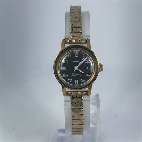 Mavin | Vintage Timex Electric Womens Black Dial Gold Tone Stainless Steel Band Watch