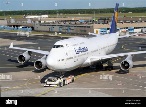 Lufthansa Boeing 747 Jumbo jet escorted to a gate at Frankfurt-Main ...