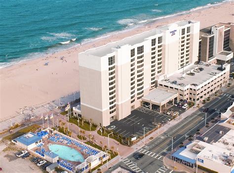 an aerial view of a hotel near the beach