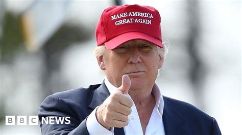 Trump's 'Make America Great Again' hats burned over Daca deal - BBC News