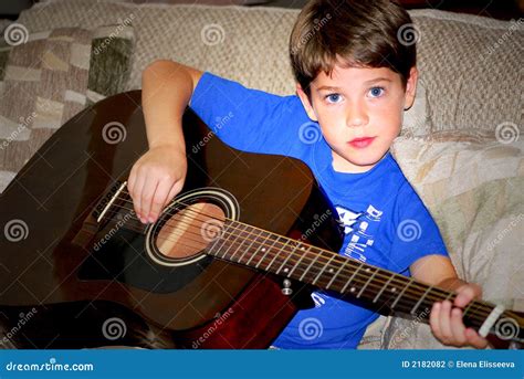 Boy play guitar stock photo. Image of male, fingers, person - 2182082