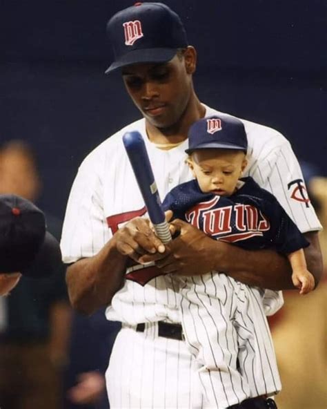 Former Twins pitcher Pat Mahomes holding his son, Patrick.. : minnesotatwins