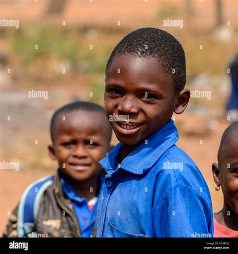 PIRA, BENIN - JAN 12, 2017: Unidentified boy in school uniform smiles ...