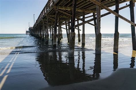 Under the Newport Beach Pier in Orange County California Photograph by ...