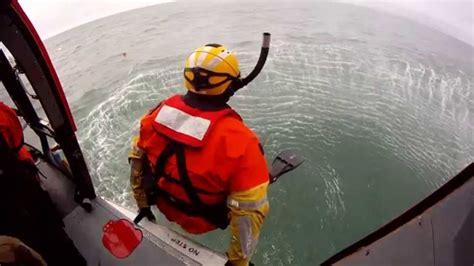 US Coast Guard Rescue Swimmer Training or Jumping from a helicopter ...