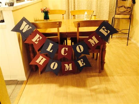 DIY Welcome Home Banner (scrapbook paper, white paint, americana stencil, foam pouncer, twine ...